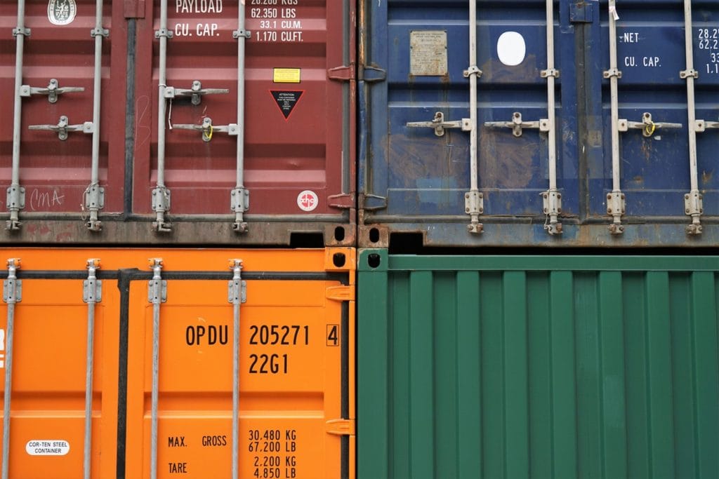 An image shipping containers ready to deliver food and beverages.