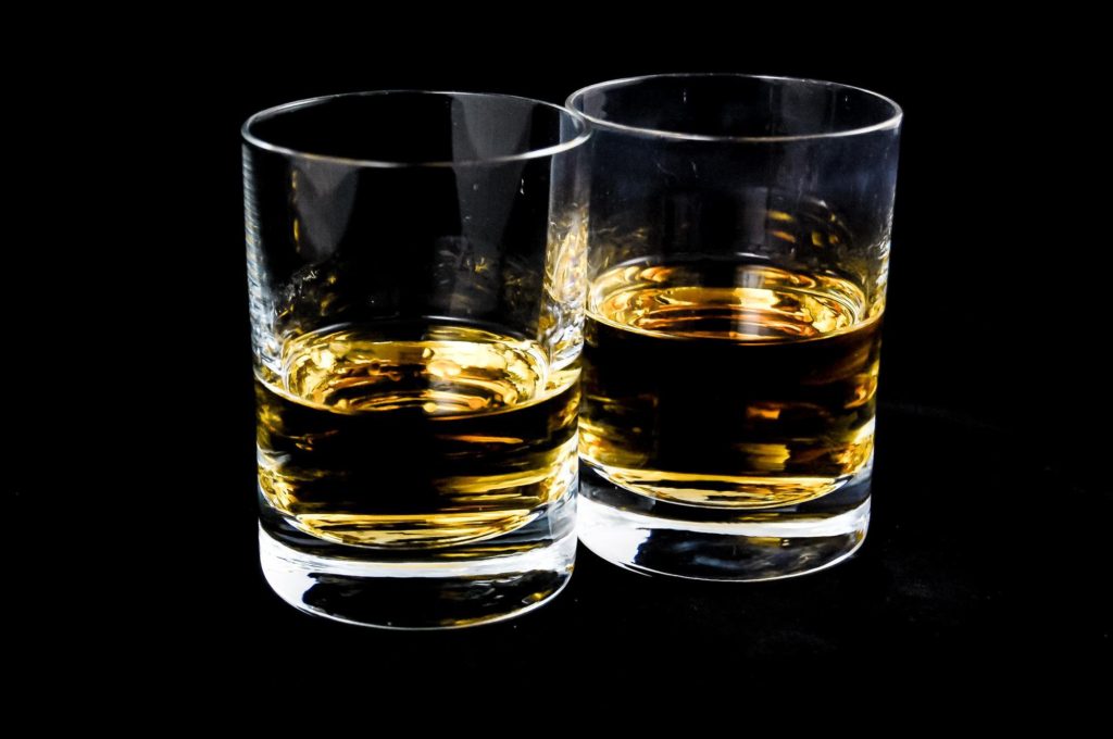 a picture of two glasses of whiskey, neat.