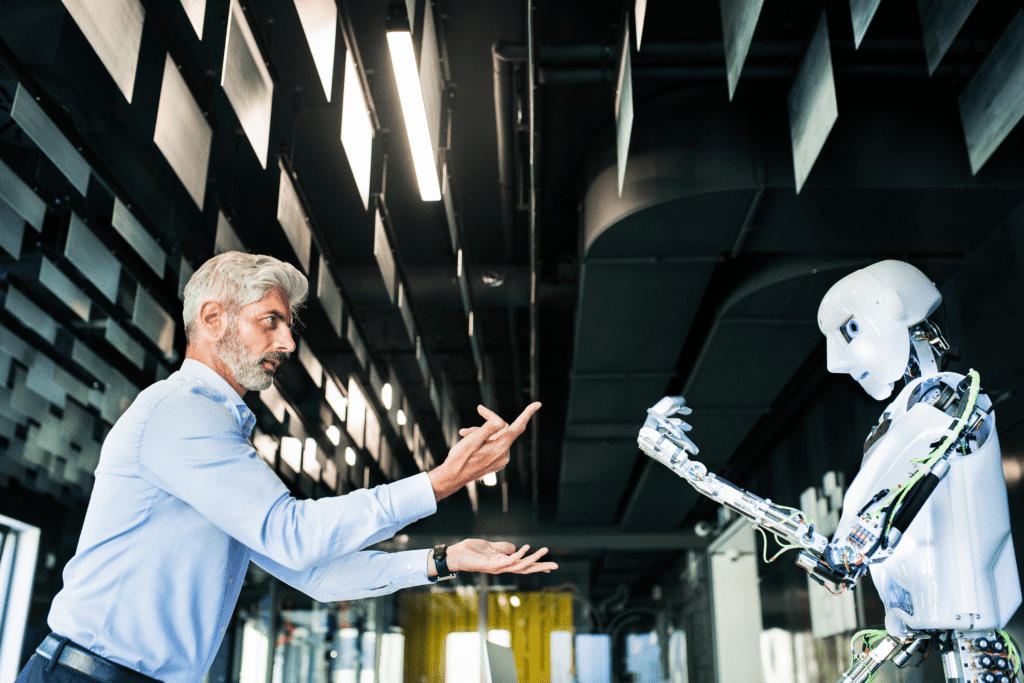 A photograph of an executive or scientist commanding a humanoid robot. industry 5.0 new roles and jobs emerge.