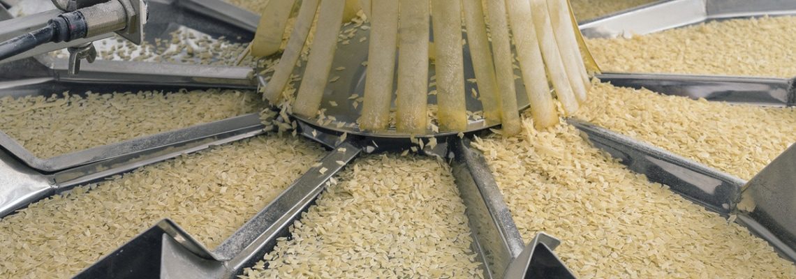 a photo of grain sorting machinery in a food processing plant. - encompass solutions.
